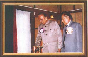 Shri M.M. Jacob,lighting a lamp to inaugurate the workshop while the Chairman,SDRC,Shri E.K. Mawlong looks on