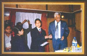 Shri J.D. Rymbai giving away the prizes to schools adjudged the best participants in ther exhibition